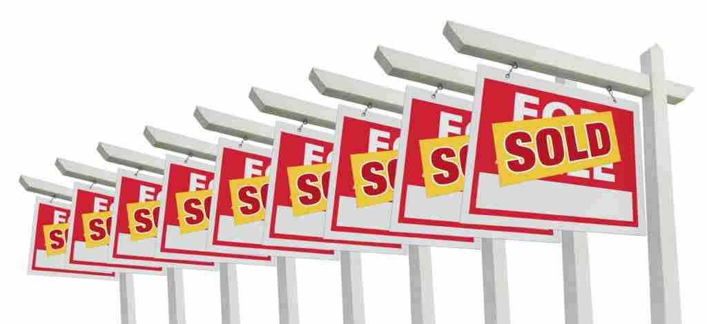 Row of Sold Home For Sale Real Estate Signs Isolated on a White