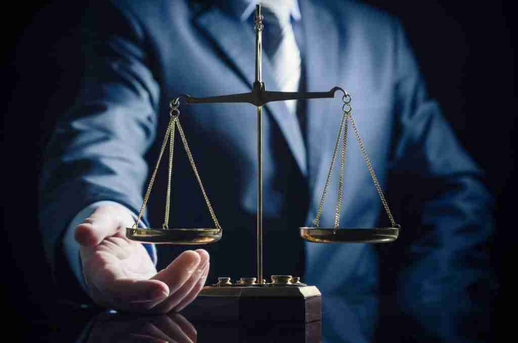 Weight Scale Of Justice, Lawyer In Background. Justice Law Lawye