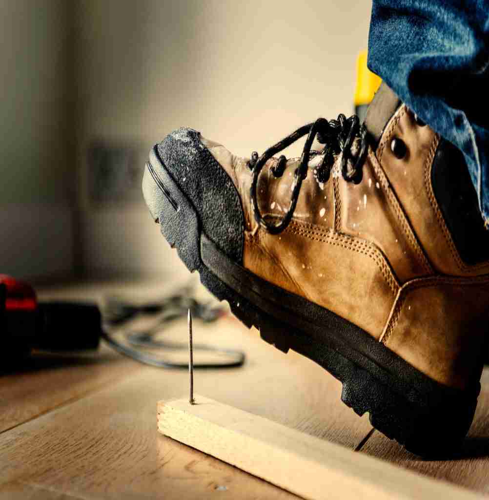 Man stepping on a nail