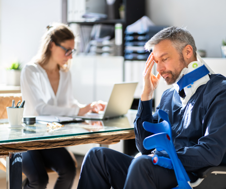 Man in wheelchair consulting attorney — is it worth hiring a personal injury attorney?