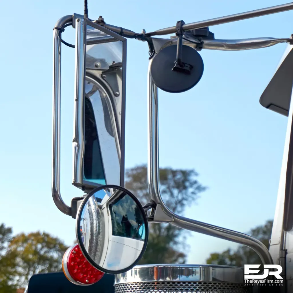 Close-up of semi-truck side and blind spot mirrors illustrating truck blind spot visibility issues – The Reyes Firm, Tampa truck accident lawyer