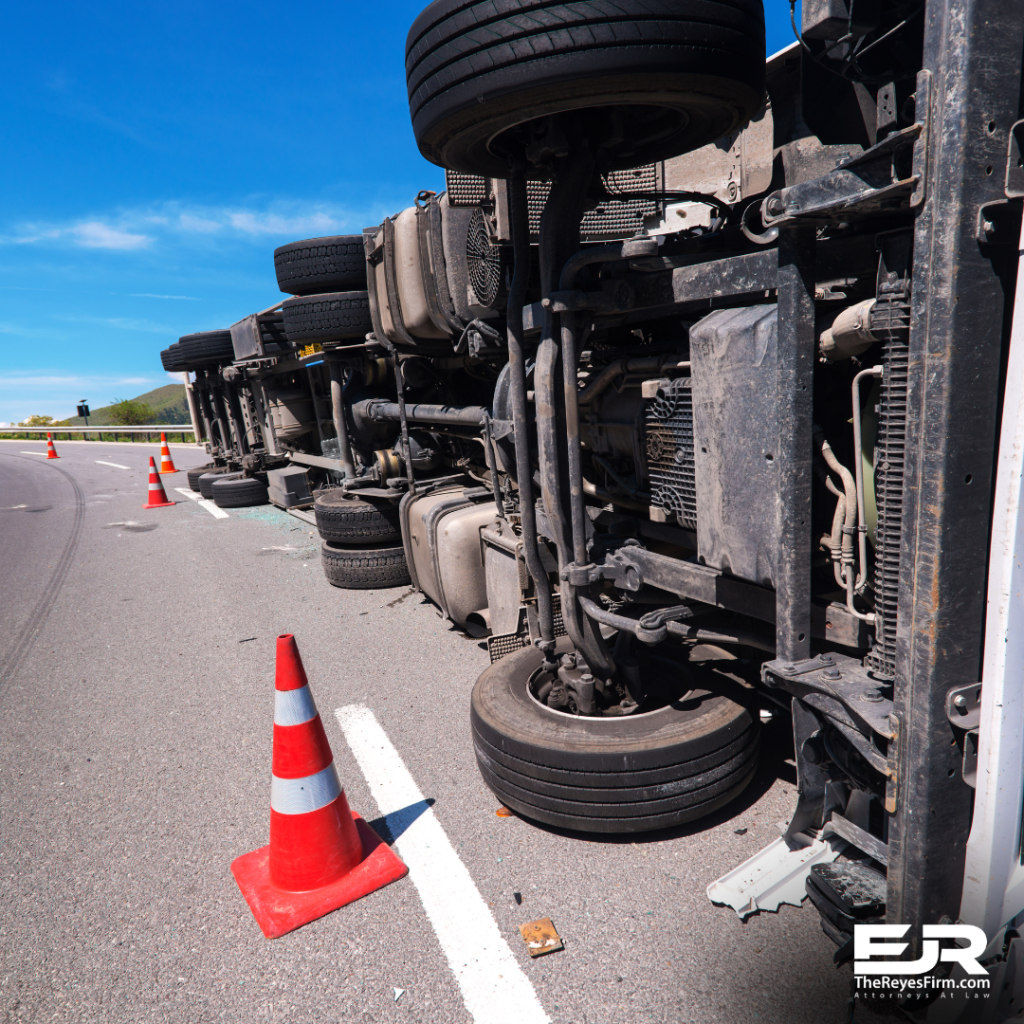 Rollover truck accident on Florida highway with traffic cones and The Reyes Firm logo