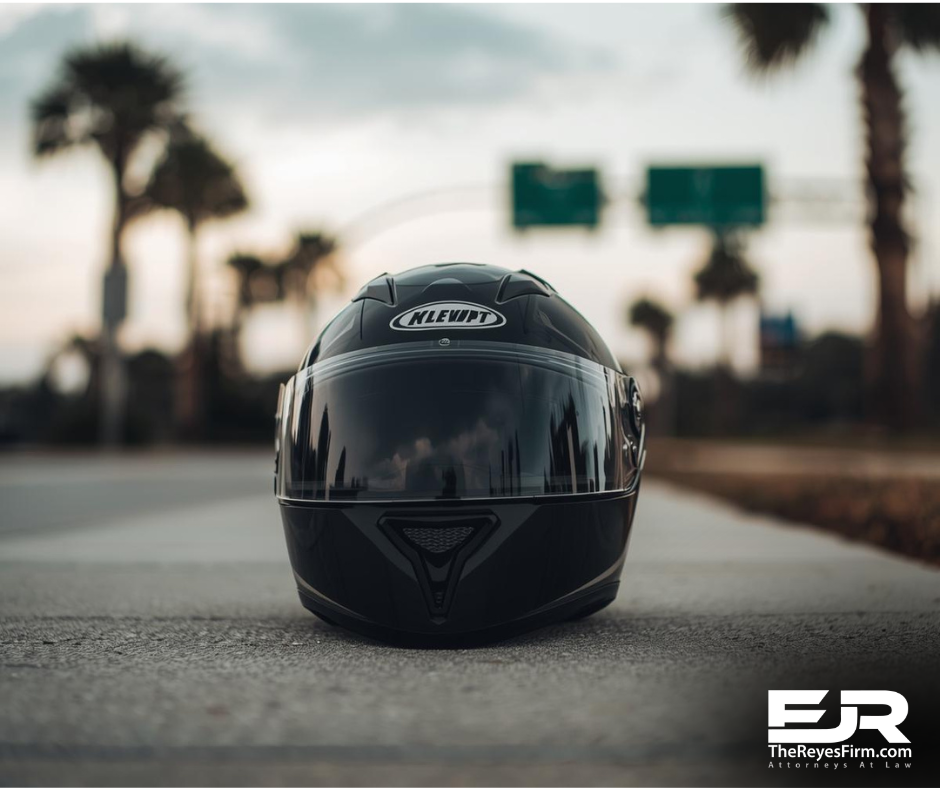 Motorcycle helmet on a roadway near highway signs, representing a motorcycle crash on I-75 and SR-54 in Wesley Chapel, Pasco County.